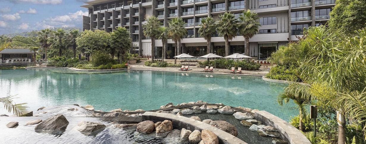 Gran Meliá Arusha — Pool and garden-facing hotel exterior.