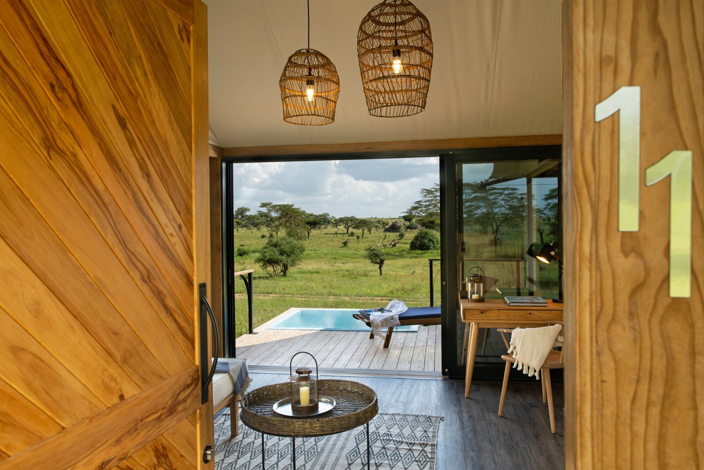 Lemala Nanyukie Serengeti — Suite bathroom opening onto an outdoor shower.