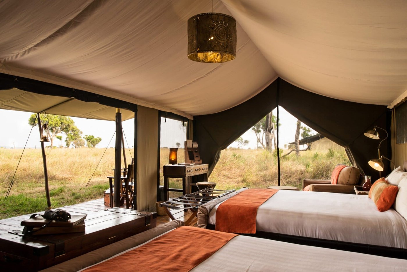 Lemala Ndutu Tented Camp — Lounge seating inside the communal tent.