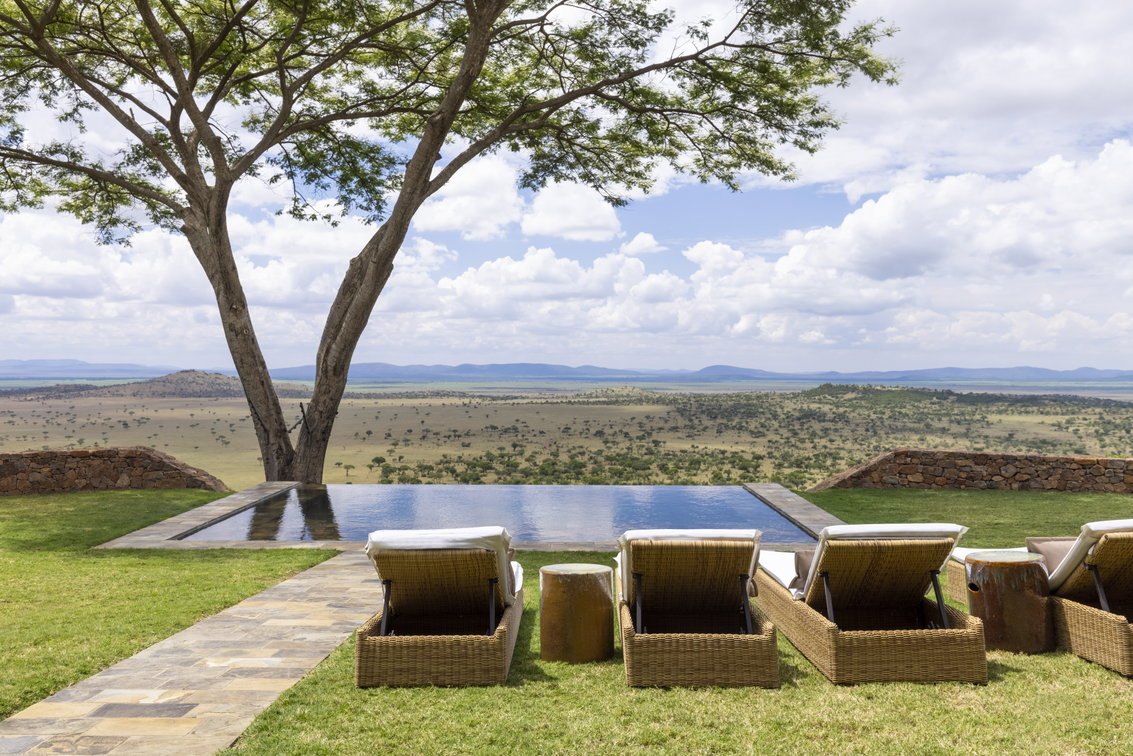 Pool and loungers above the Grumeti Reserve