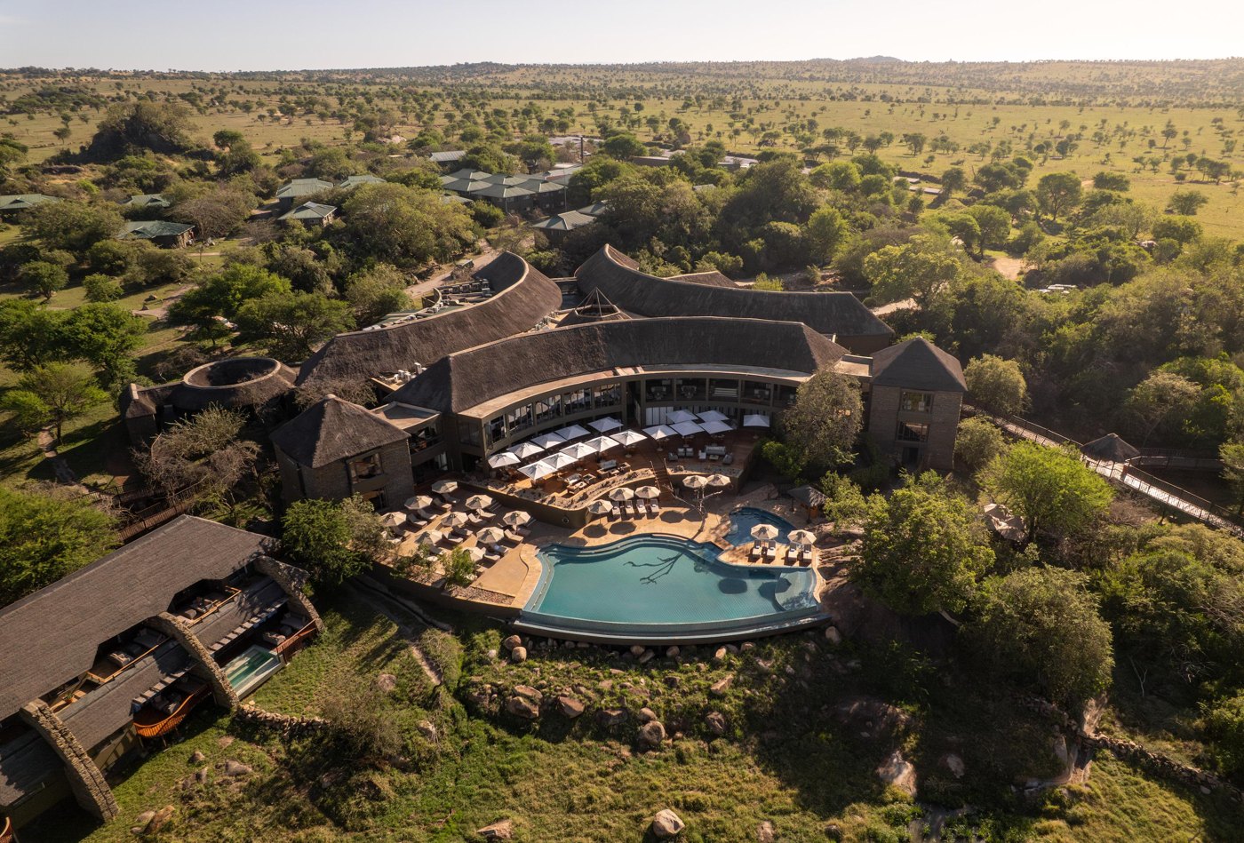 Aerial view of a luxury Serengeti lodge and its pool