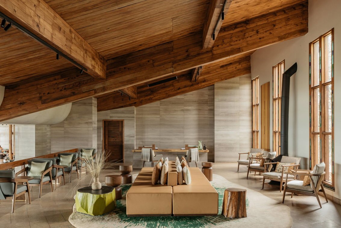 Meliá Ngorongoro — Main guest lounge with timber-beamed ceiling.